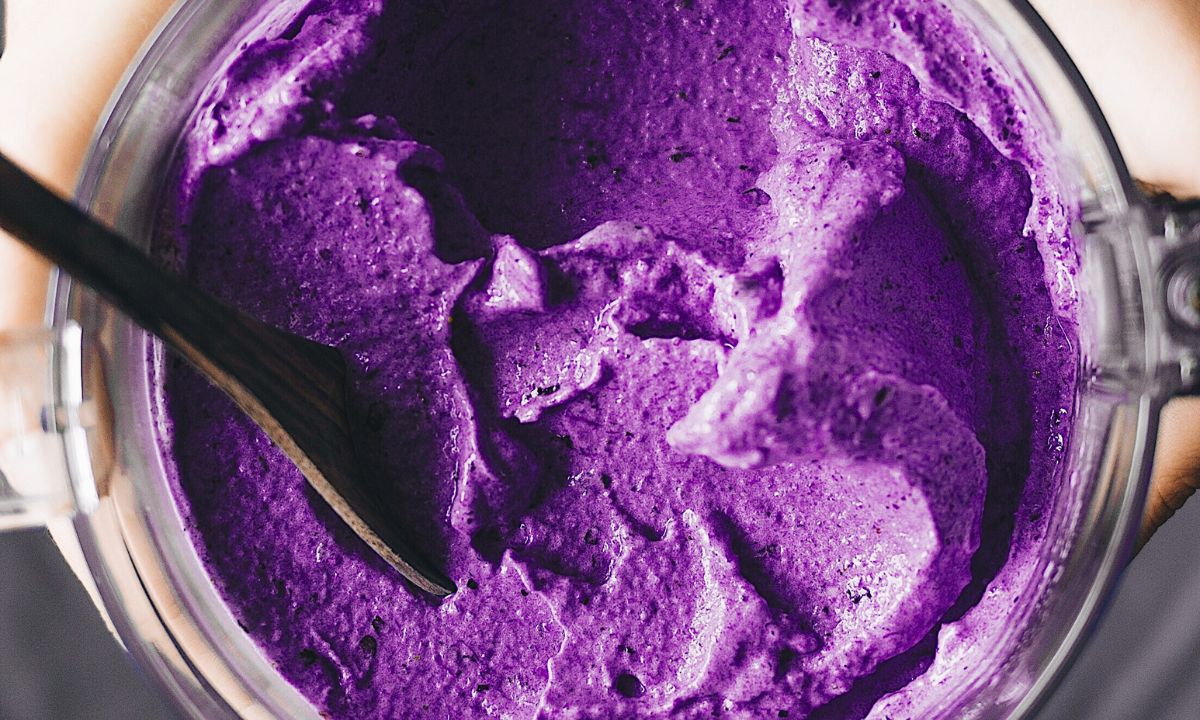 Purple smoothie  with a purple sweet potato powder in a blender 
